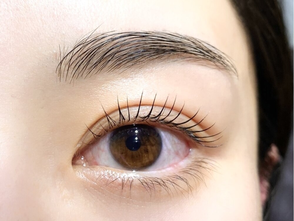 Close-up of a lash lift and brow styling by Polar
